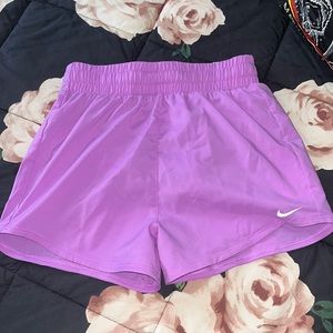 Nike athletic shorts in purple. kids size medium. BRAND NEW